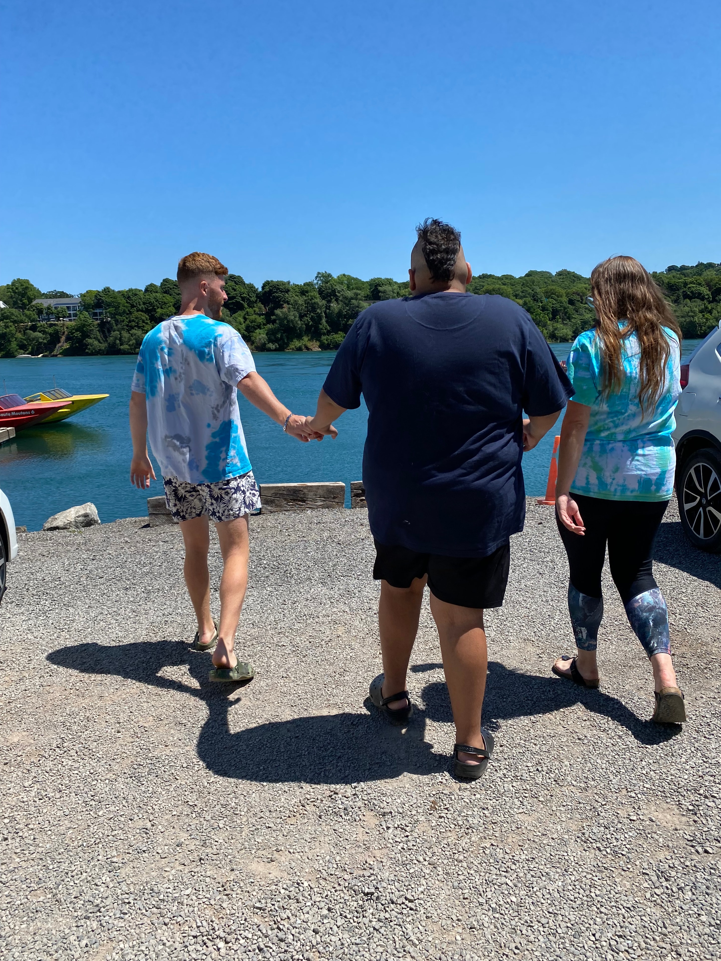 Day program participants enjoying a community outing by the water